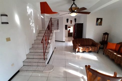 stairs-to-upper-level-and-foyer-to-living-room